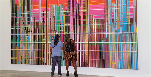 people looking at art