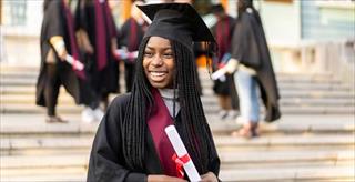graduate in cap and gown
