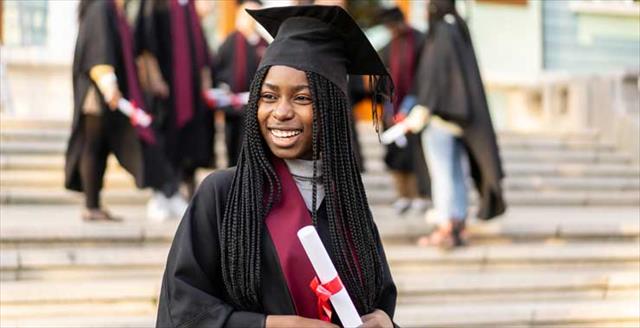 graduate in cap and gown