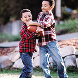 boys playing football