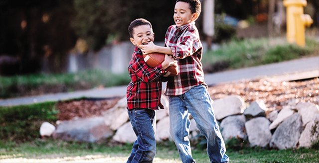 boys playing football