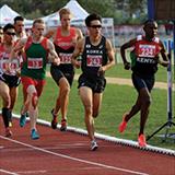runners competing on an indoor track