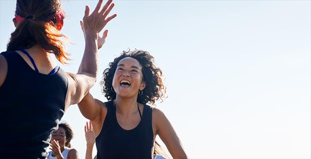 two women giving high fives