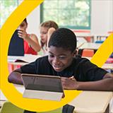 boy using tablet in a classroom