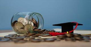 jar of change plus a mini graduation hat