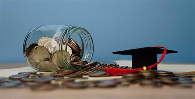 jar of change plus a mini graduation hat