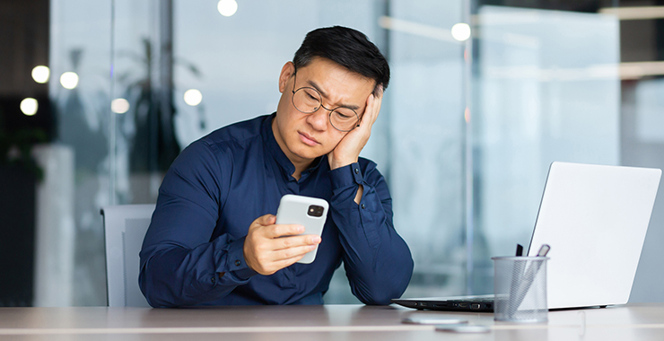 man looking at a smartphone