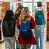 students wearing backpacks