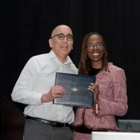 Thema Bryant, PhD, presents Presidential Citation to Gordon Hall, PhD