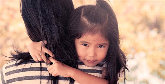 Parent holding a small child