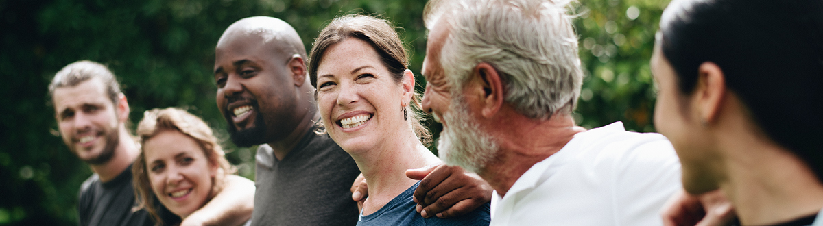 Diverse group of adults showing support and expressions of happiness
