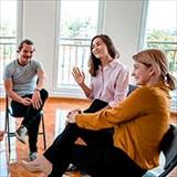 people sitting in a group talking