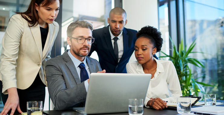 Cropped shot of a group of business colleagues meeting in the boardroom