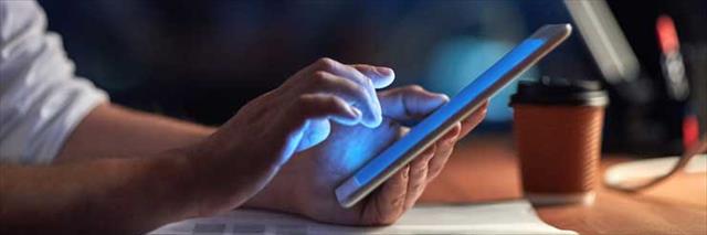 man on tablet device