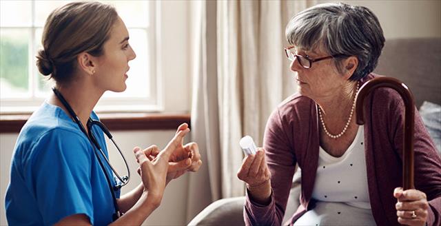 nurse talking with female patient about her medication
