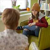 teen speaking with a counselor