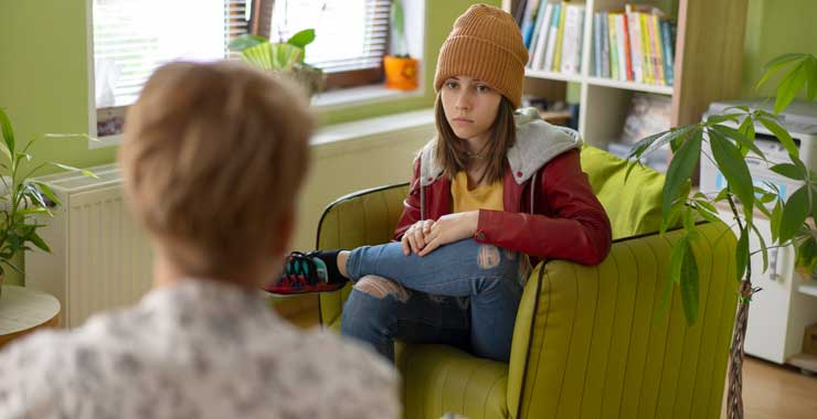 teen speaking with a counselor