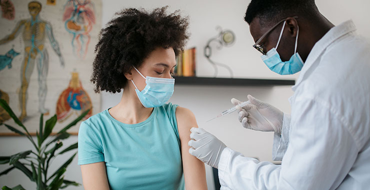 woman receiving a vaccine