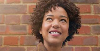 young woman looking upward