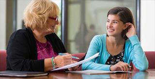 educational psychologist talking to teen girl