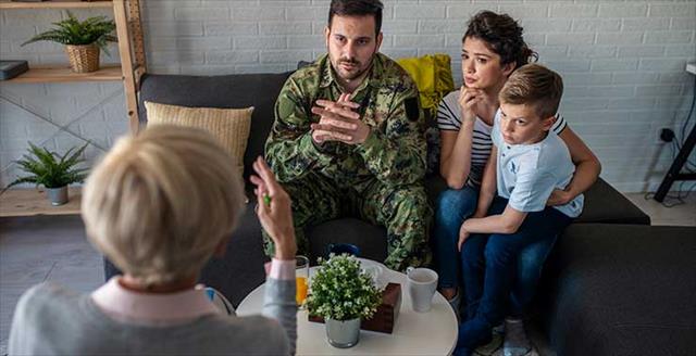 soldier and his family with a psychotherapist during a session
