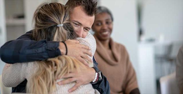 people in a group therapy session