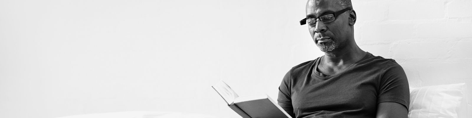 Man reading in bed