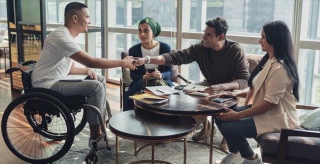 Small group of psychologists seated in a circle talking with one another