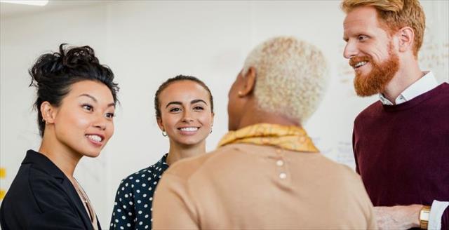 A small group of young and established psychology professionals chatting