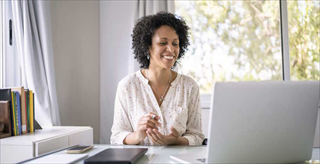 Woman sitting at her laptop