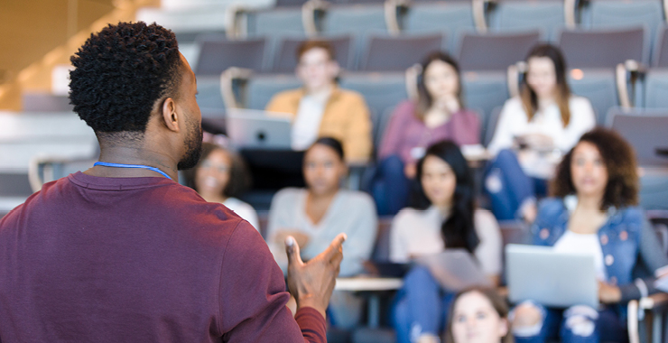 Photograph of professor lecturing to class