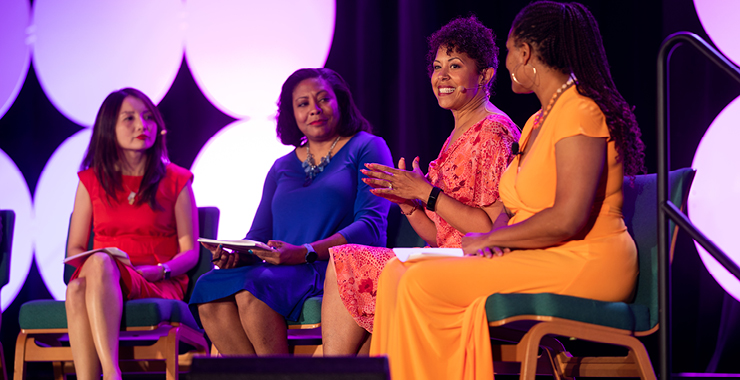 Photograph of lecturers in a panel setting