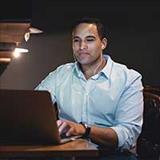 research paper topics on brain cancer man looking at laptop