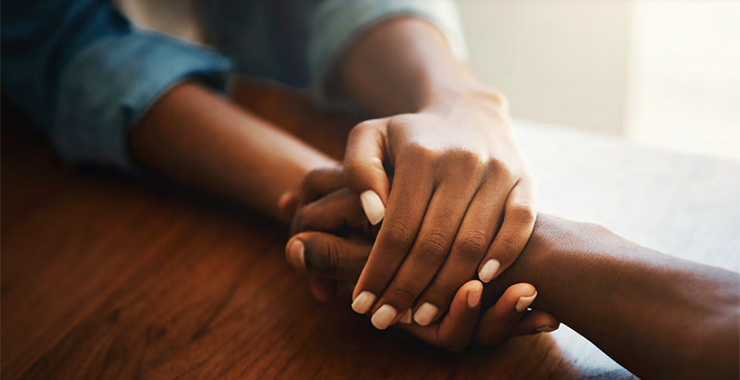person holding someone else's hand