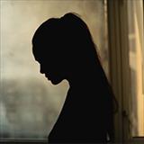 silhouette of woman in front of window 