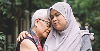 two women consoling each other