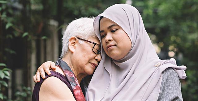 two women consoling each other