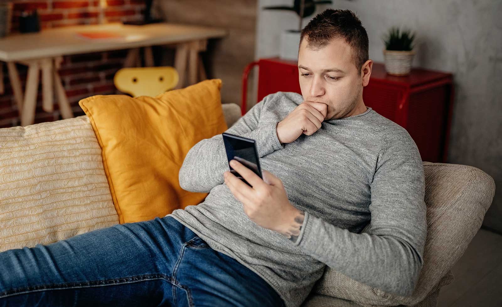 man looking at smartphone