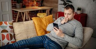 man looking at smartphone