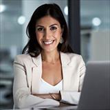 Woman smiling near laptop