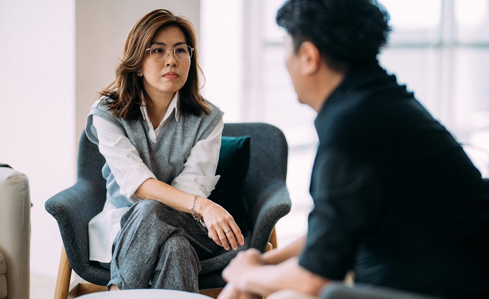 Woman with glasses in a meeting