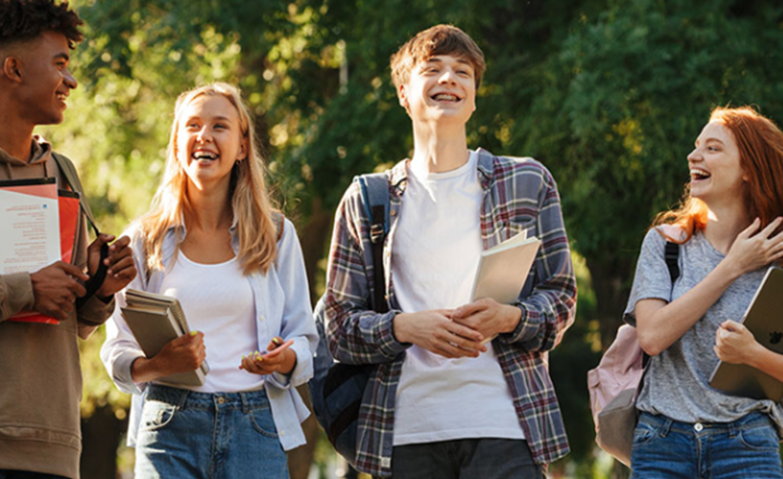Group of young students outside laughing