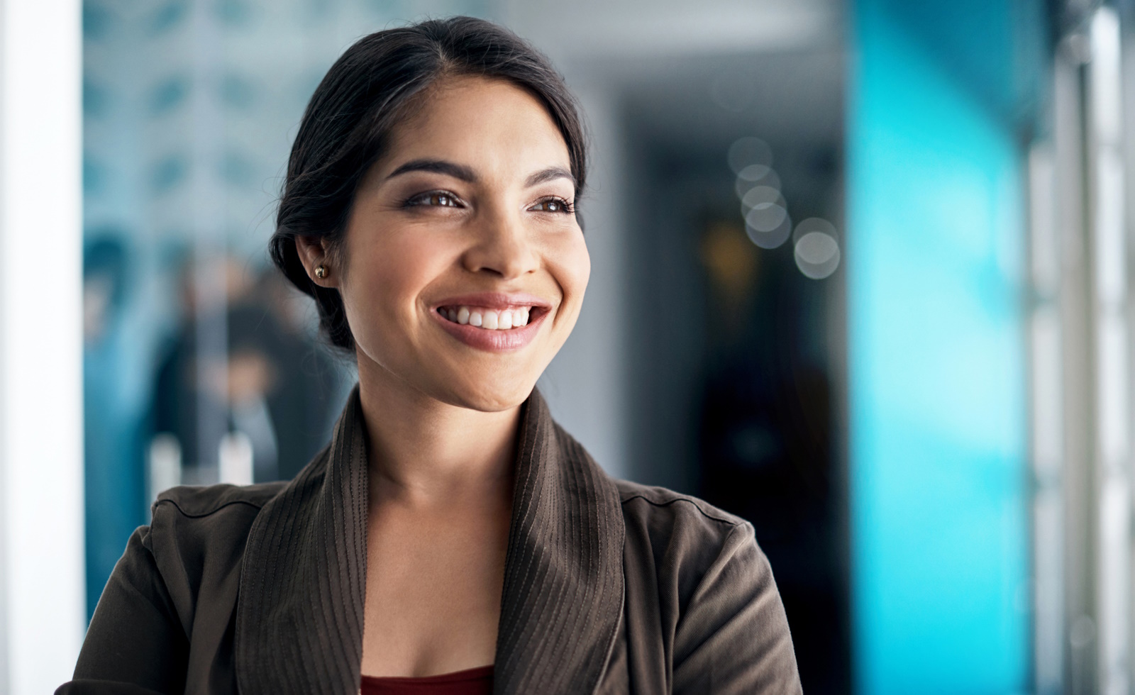 Image of a designer smiling in an office