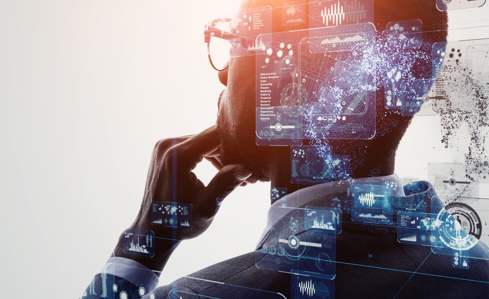 man looking pensive with overlay of computer graphics