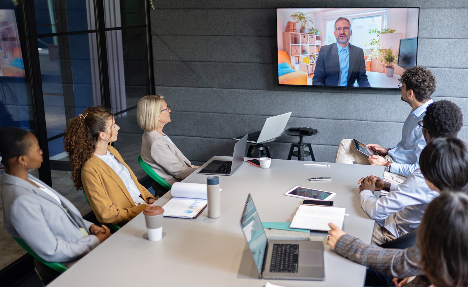 Colleagues communicate with the CEO by video conference