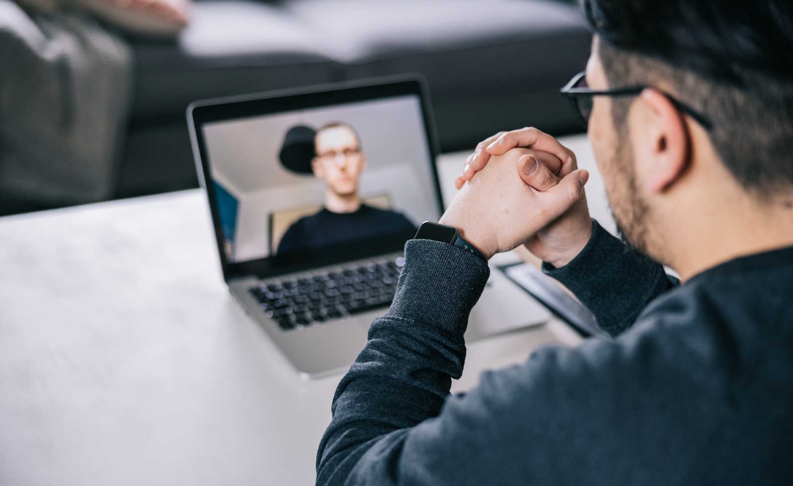 Man taking part of a video call from home 