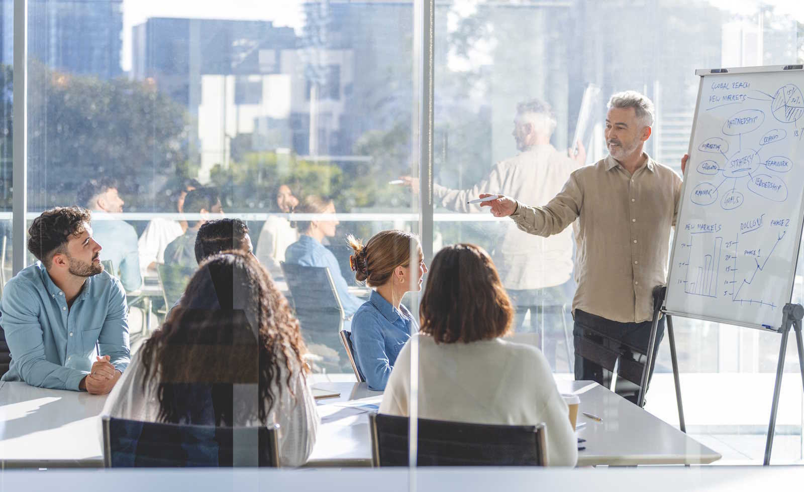 Business people watching a presentation on the whiteboard