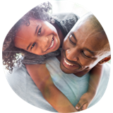 Father and daughter smiling