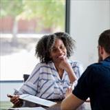 Woman smiling at student
