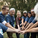 Group of people touching hands